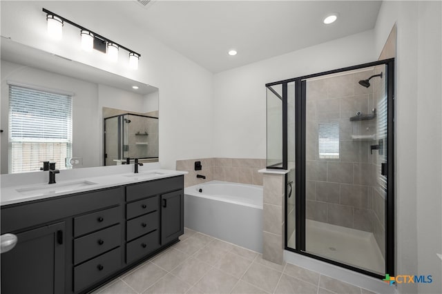 bathroom with vanity, plus walk in shower, and tile patterned floors