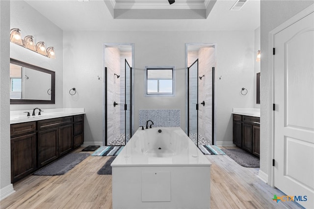 bathroom featuring hardwood / wood-style floors, vanity, and ornamental molding