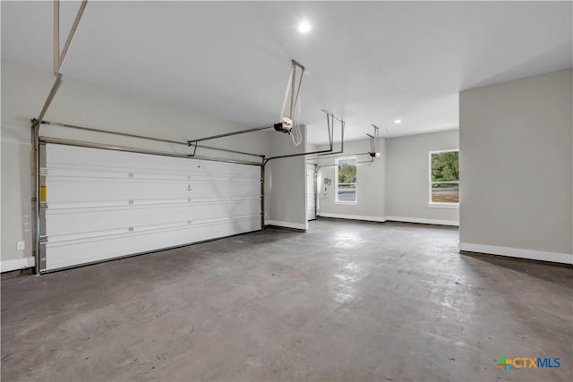 113 Cobblestone Ln, Burnet, TX 78611 - garage with recessed lighting, a garage door opener, and baseboards