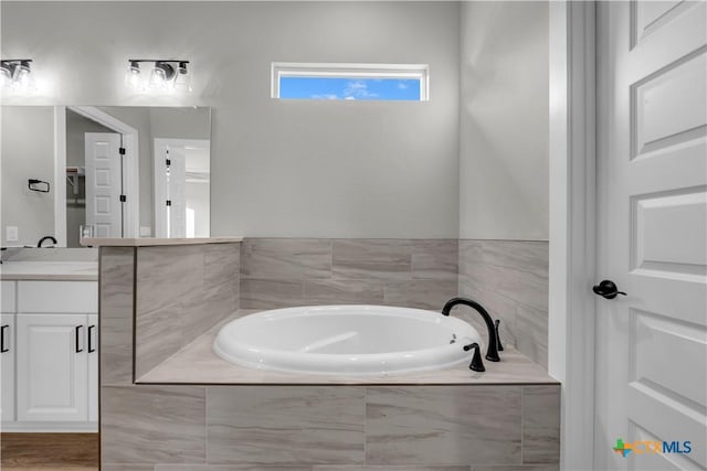 113 Cobblestone Ln, Burnet, TX 78611 - full bathroom with a garden tub and vanity