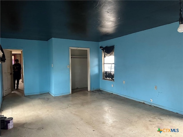 unfurnished bedroom featuring a closet and tile patterned floors