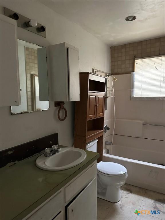 full bath with toilet, shower / bath combination, and vanity