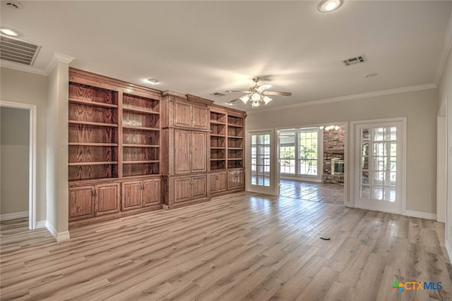 unfurnished living room with crown molding, ceiling fan, french doors, and light hardwood / wood-style floors