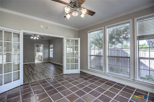 unfurnished sunroom with ceiling fan and french doors