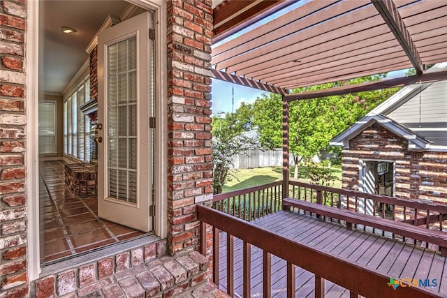 wooden deck featuring a pergola