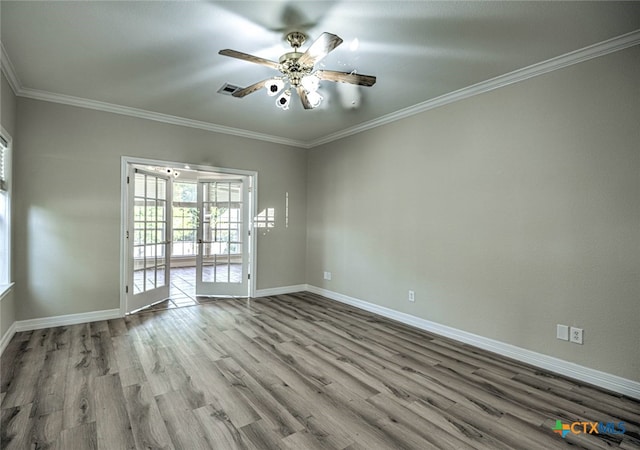 empty room with ceiling fan, french doors, ornamental molding, and light wood-type flooring