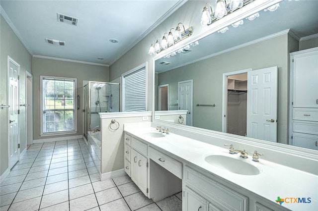 bathroom with tile patterned floors, vanity, an enclosed shower, and ornamental molding