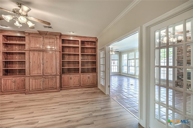 unfurnished living room with ceiling fan, light hardwood / wood-style floors, ornamental molding, and french doors