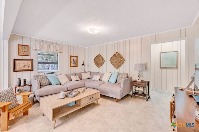 living room featuring wood walls