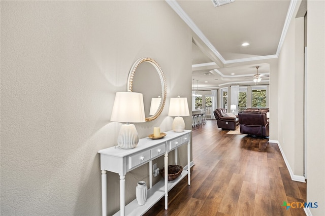 hall featuring dark hardwood / wood-style flooring, coffered ceiling, and ornamental molding