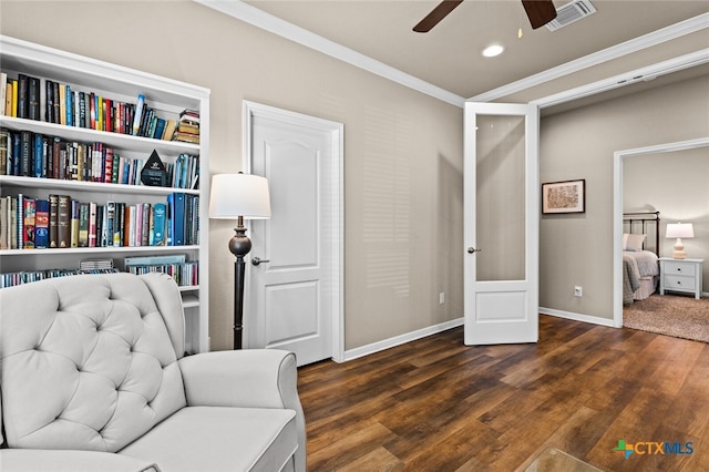 sitting room with crown molding, french doors, ceiling fan, and dark hardwood / wood-style floors