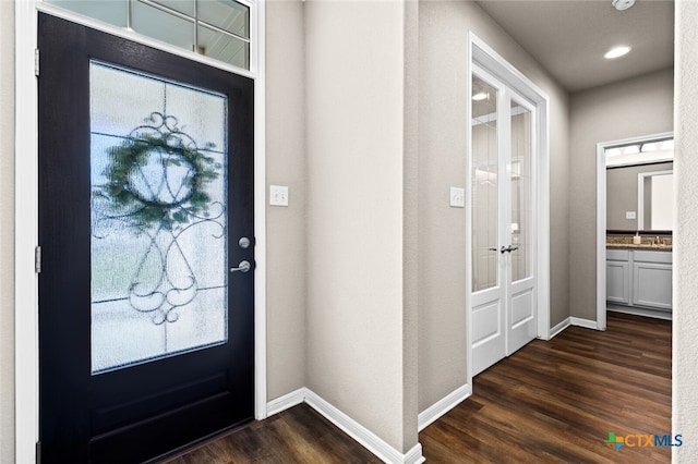 foyer featuring dark hardwood / wood-style floors and plenty of natural light