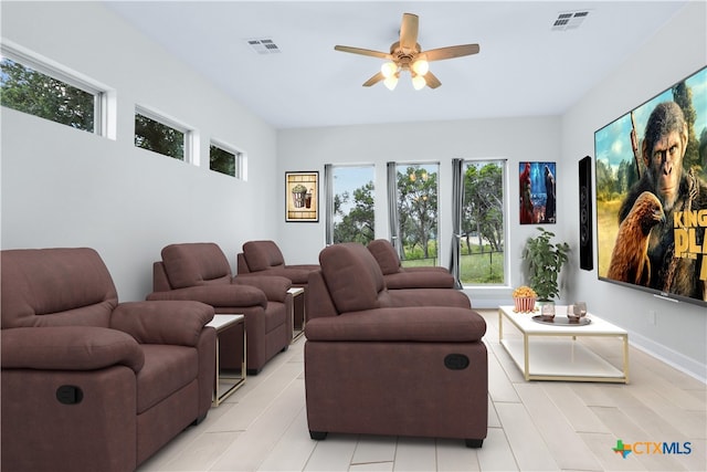 cinema room with ceiling fan