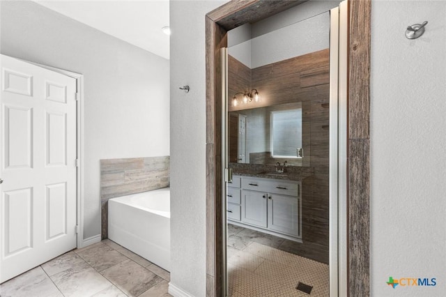 7917 Purvis St, Temple, TX 76502 - full bath featuring vanity, a bath, and marble finish flooring