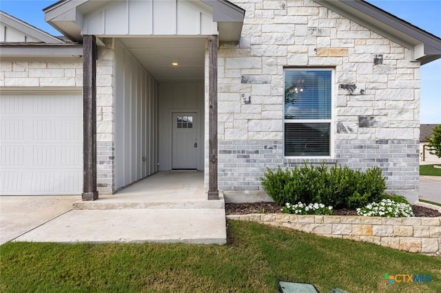 7917 Purvis St, Temple, TX 76502 - doorway to property featuring board and batten siding, a garage, and stone siding