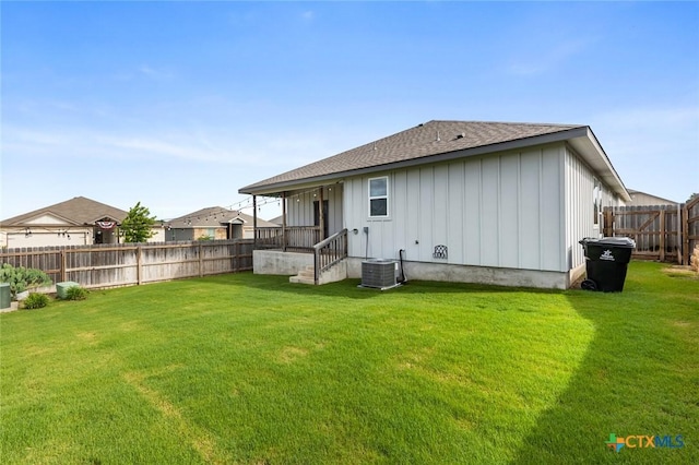 7917 Purvis St, Temple, TX 76502 - rear view of house featuring board and batten siding, roof with shingles, and a fenced backyard