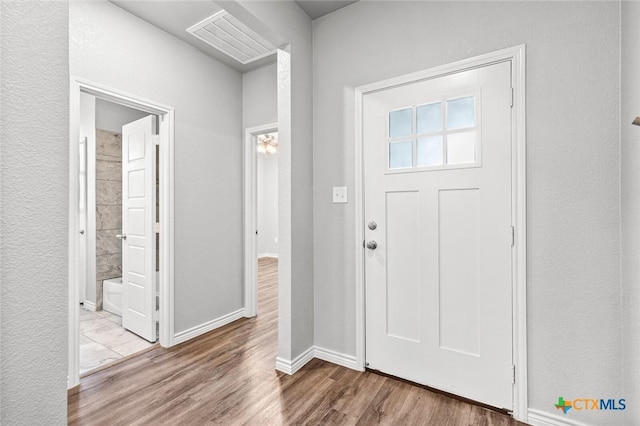 7917 Purvis St, Temple, TX 76502 - foyer entrance featuring wood finished floors and baseboards