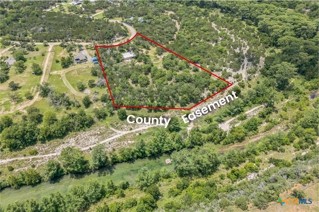 959 Highland Dr, Bandera, TX 78003 - aerial view of property and surrounding area featuring property boundaries highlighted