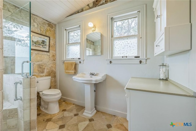 959 Highland Dr, Bandera, TX 78003 - bathroom featuring a stall shower, lofted ceiling, and tile patterned flooring