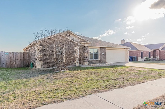 view of front facade with a garage and a front lawn