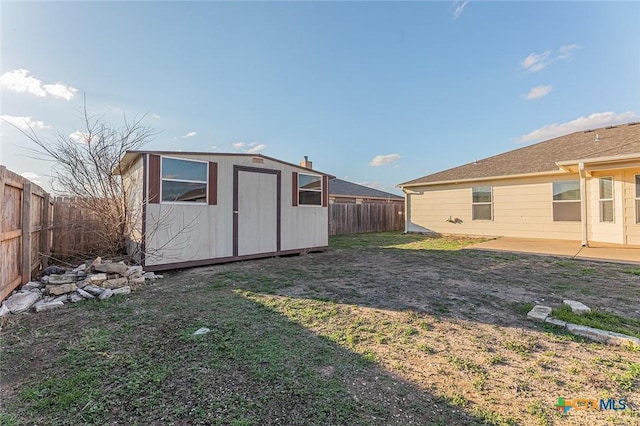 view of yard featuring a patio area and a shed