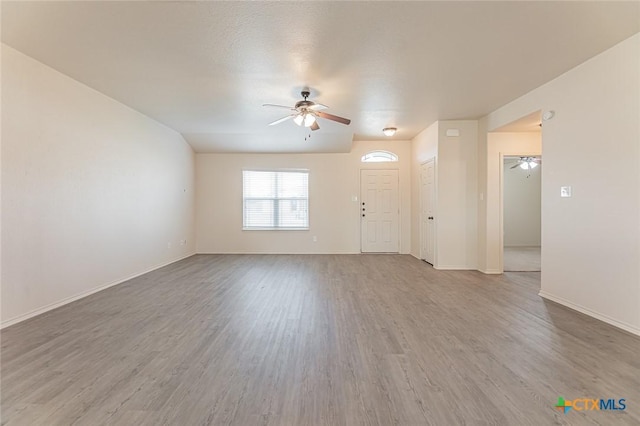 unfurnished room featuring hardwood / wood-style flooring and ceiling fan