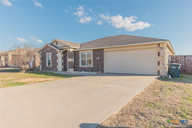 ranch-style home featuring a garage and a front yard