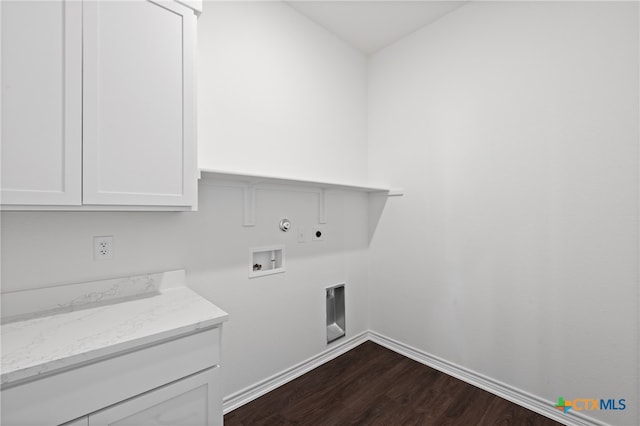 laundry room with cabinets, gas dryer hookup, hookup for a washing machine, dark hardwood / wood-style floors, and hookup for an electric dryer