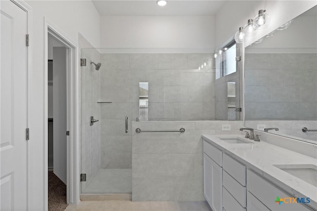 7308 Caladium Dr, Temple, TX 76502 - bathroom featuring a shower stall, double vanity, and tile patterned floors