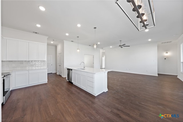 kitchen featuring white cabinets, stainless steel appliances, a kitchen island with sink, and dark wood-type flooring