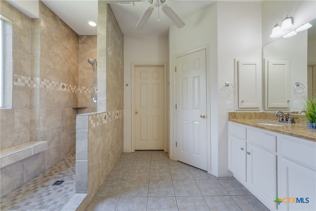 1763 Oak Gln, New Braunfels, TX 78132 - bathroom with walk in shower, vanity, ceiling fan, and tile patterned flooring
