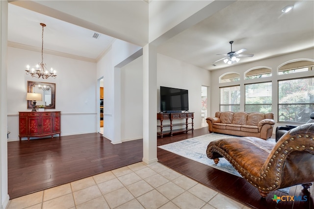 1763 Oak Gln, New Braunfels, TX 78132 - living room with light tile patterned flooring, a ceiling fan, crown molding, and a chandelier