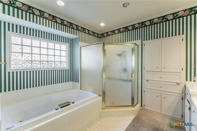 full bath with wallpapered walls, a garden tub, recessed lighting, a stall shower, and vanity