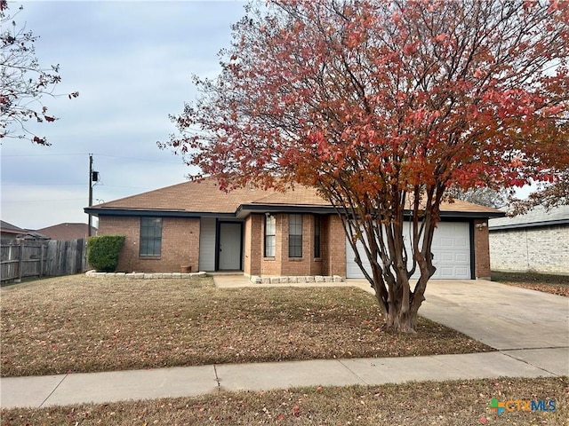 view of front facade with a garage and a front yard