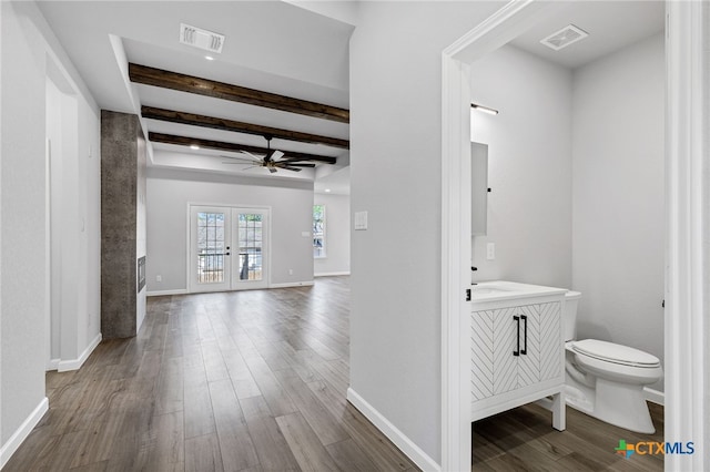 9923 Loma Alta Cir, Converse, TX 78109 - hallway with beamed ceiling, wood finished floors, and french doors