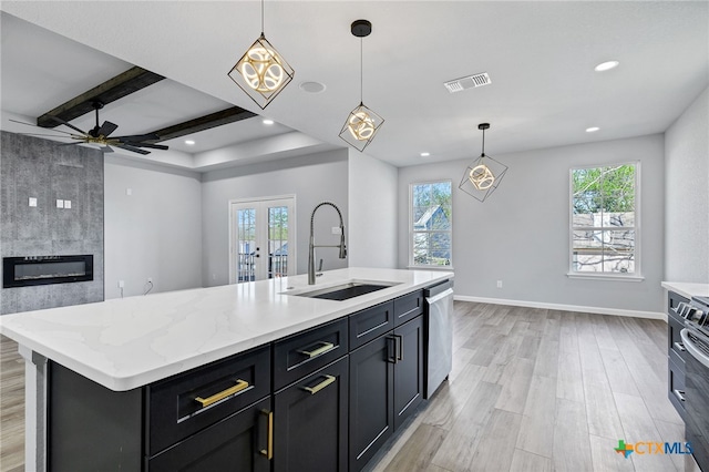 9923 Loma Alta Cir, Converse, TX 78109 - kitchen with dishwasher, light wood-style floors, plenty of natural light, open floor plan, and recessed lighting