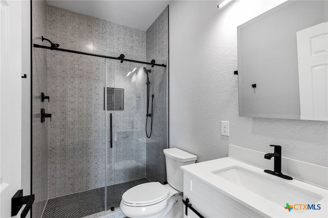 9923 Loma Alta Cir, Converse, TX 78109 - bathroom with vanity, a stall shower, and a textured wall