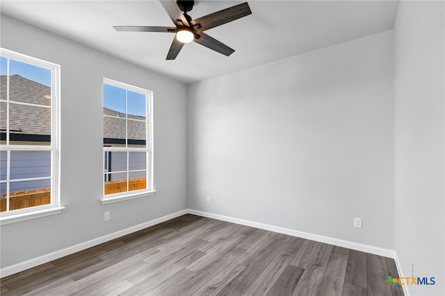 9923 Loma Alta Cir, Converse, TX 78109 - unfurnished room with wood finished floors and a ceiling fan
