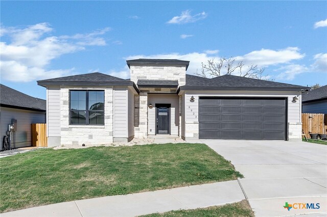 9923 Loma Alta Cir, Converse, TX 78109 - view of front of house with an attached garage, driveway, and stone siding