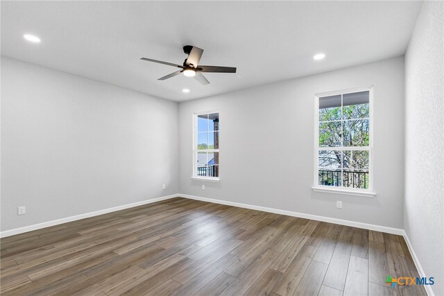 9923 Loma Alta Cir, Converse, TX 78109 - unfurnished room with ceiling fan, dark wood-type flooring, and recessed lighting