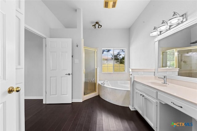 1546 W Fm 93rd Hwy Unit 207, Temple, TX 76502 - bathroom featuring vanity, a shower stall, a bath, and healthy amount of natural light