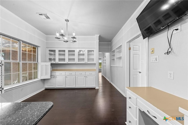 1546 W Fm 93rd Hwy Unit 207, Temple, TX 76502 - kitchen featuring a chandelier, white cabinets, crown molding, glass insert cabinets, and hanging light fixtures