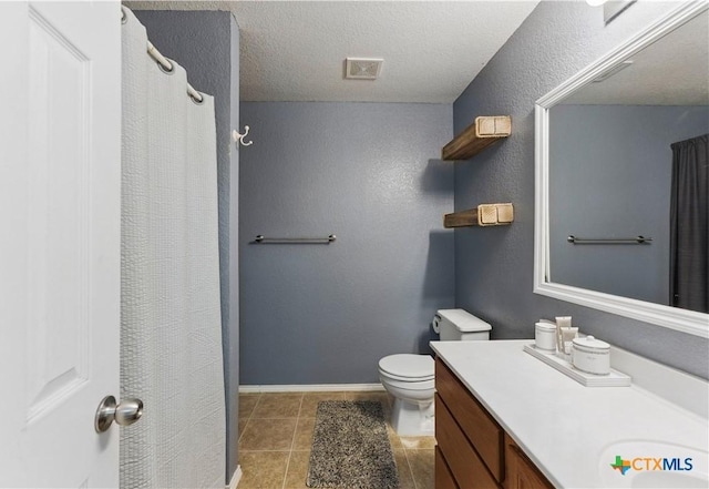 7611 Presidio Crk, Boerne, TX 78015 - bathroom featuring vanity, baseboards, visible vents, a textured ceiling, and toilet