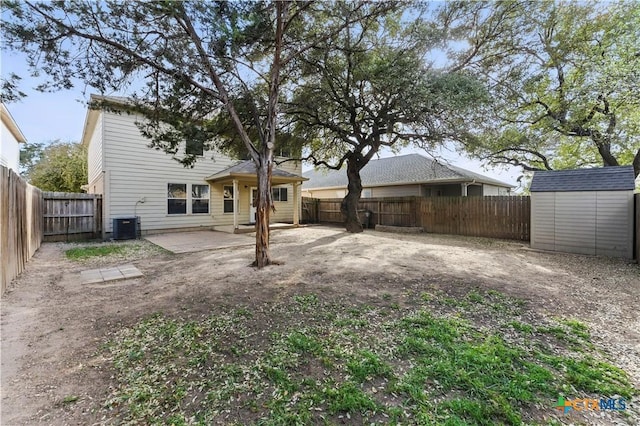 7611 Presidio Crk, Boerne, TX 78015 - back of house with a storage unit, a patio, an outbuilding, and a fenced backyard
