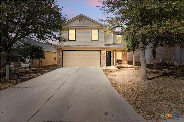 7611 Presidio Crk, Boerne, TX 78015 - traditional-style house with brick siding, a garage, and driveway