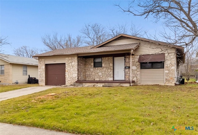 view of front of house with a garage, a front yard, stone siding, and concrete driveway