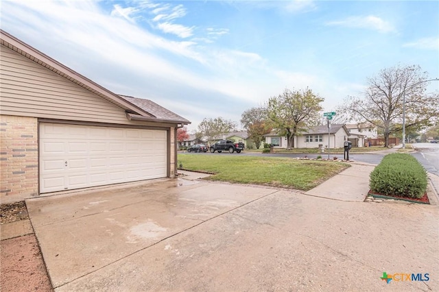 garage featuring a yard