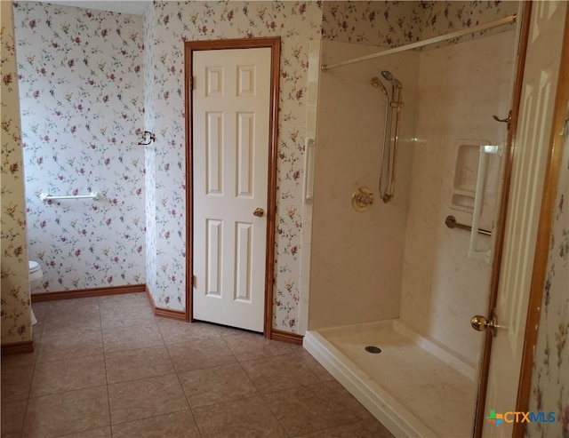 bathroom with walk in shower and tile patterned floors