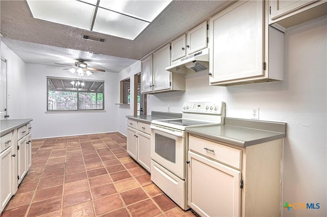 2006 Canyon Creek Dr, Temple, TX 76502 - kitchen with white electric range, under cabinet range hood, ceiling fan, and a textured ceiling