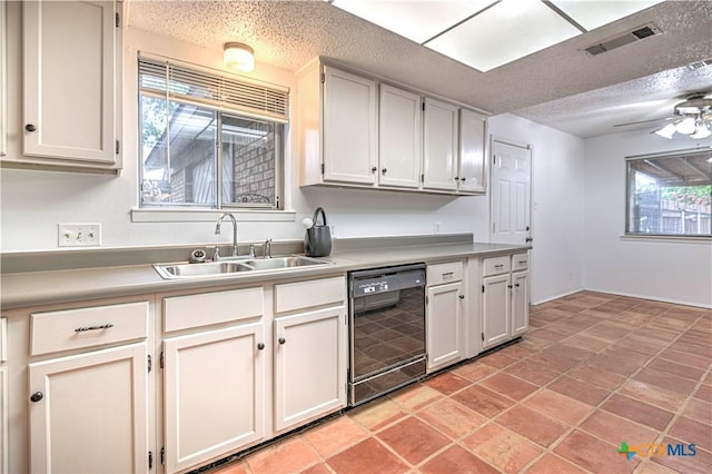 2006 Canyon Creek Dr, Temple, TX 76502 - kitchen featuring dishwasher, a textured ceiling, light countertops, and healthy amount of natural light
